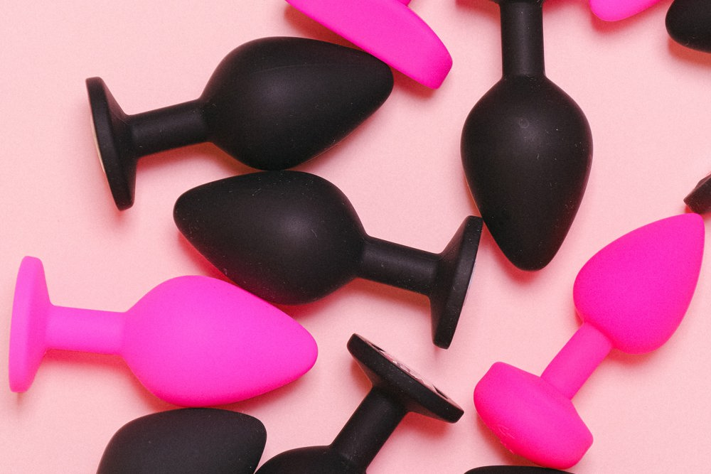 Black and pink colored butt plugs.
