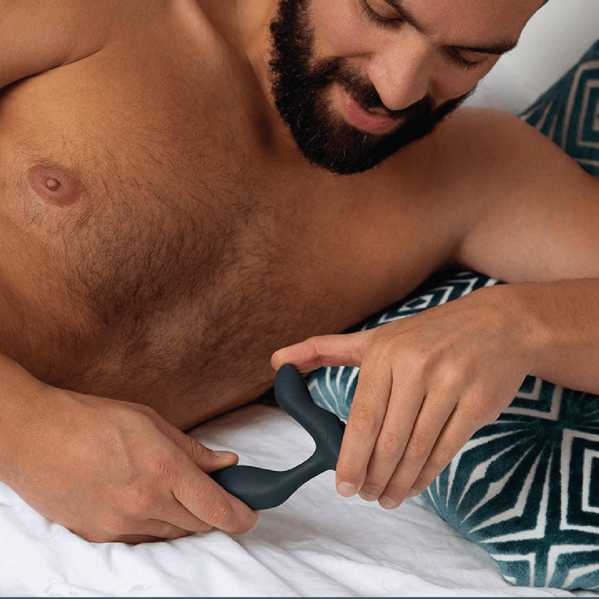 A man with the prostate massager Vector from We-Vibe in his hands.