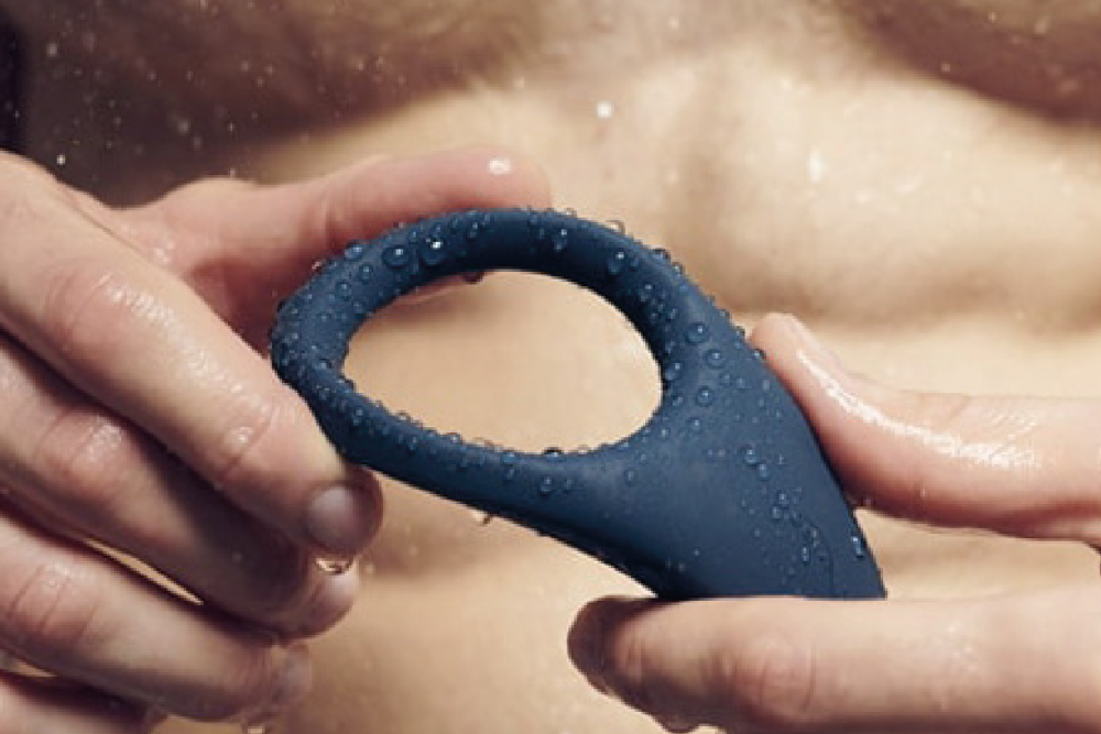 Close up image of man holding the penis ring Verge by We-Vibe in his hands.